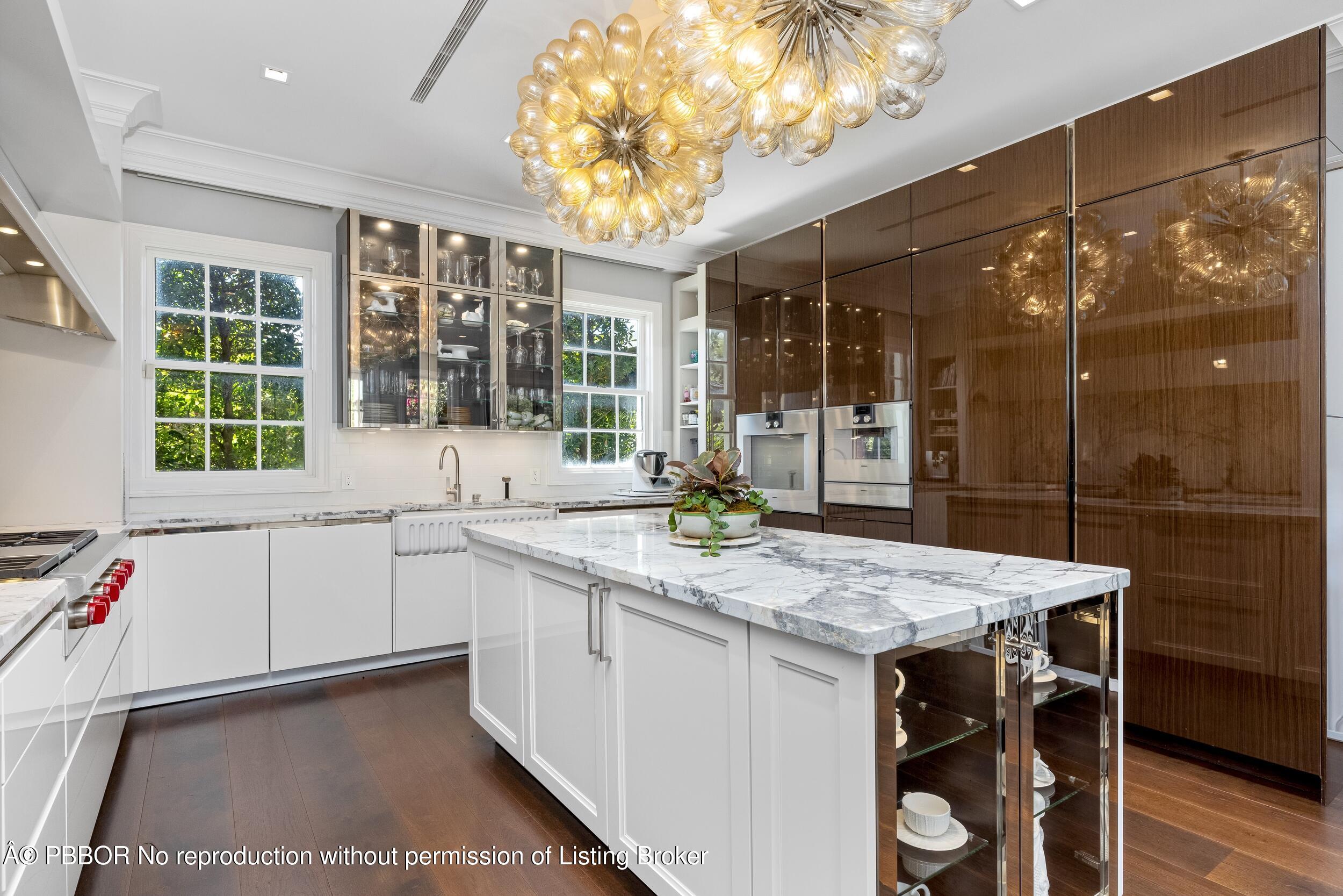 1053 North Lake Way Palm Beach, FL 33480 - Photo 26 of 82 a kitchen with a stove a sink and a refrigerator