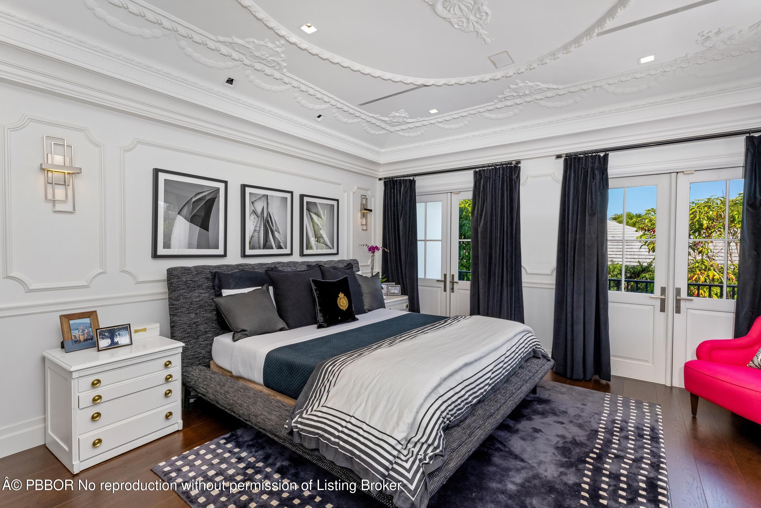 1053 North Lake Way Palm Beach, FL 33480 - Photo 37 of 82 a bedroom with a large bed and a window