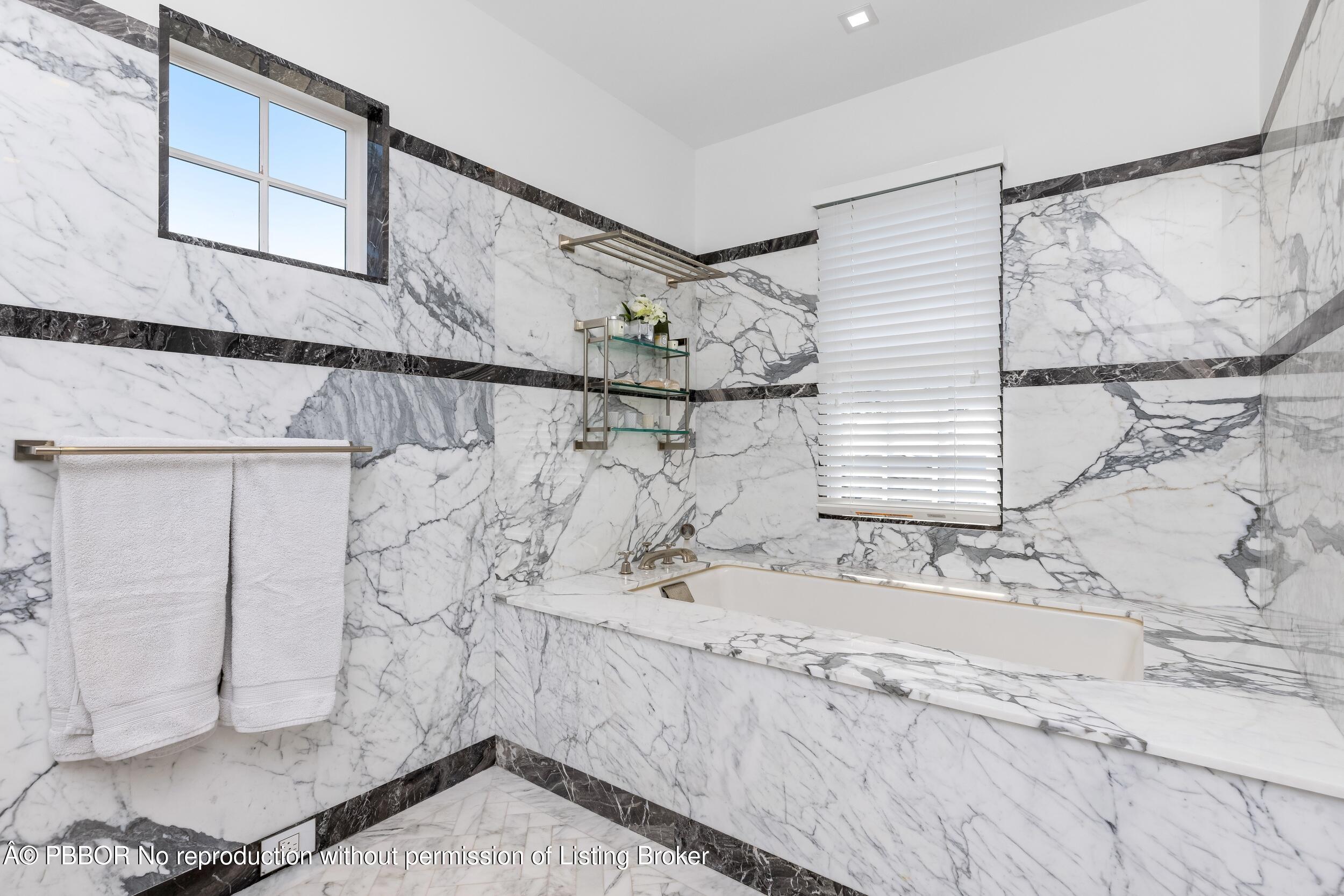 1053 North Lake Way Palm Beach, FL 33480 - Photo 41 of 82 a bathroom with a sink and mirror