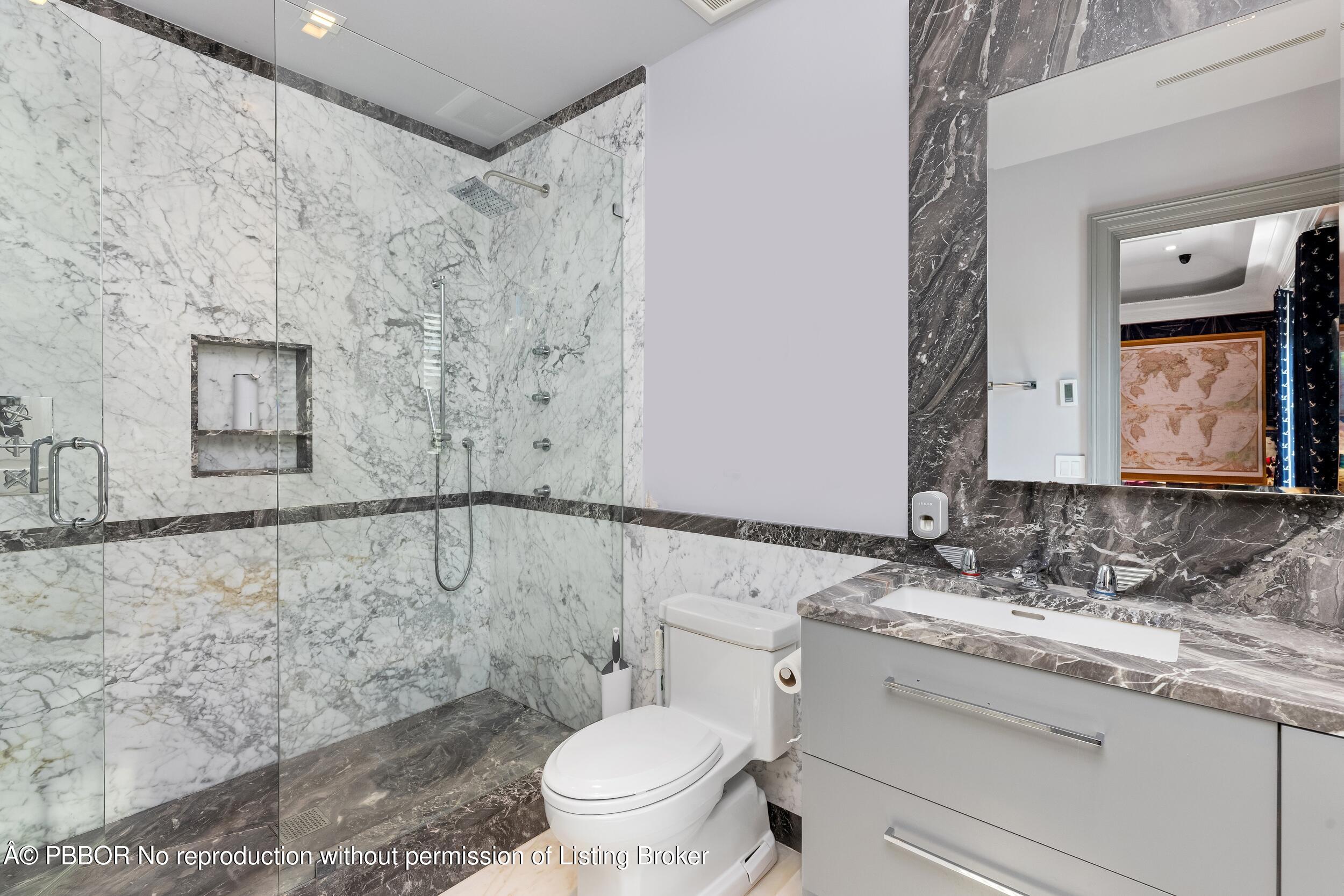 1053 North Lake Way Palm Beach, FL 33480 - Photo 45 of 82 a bathroom with a granite countertop sink toilet and shower
