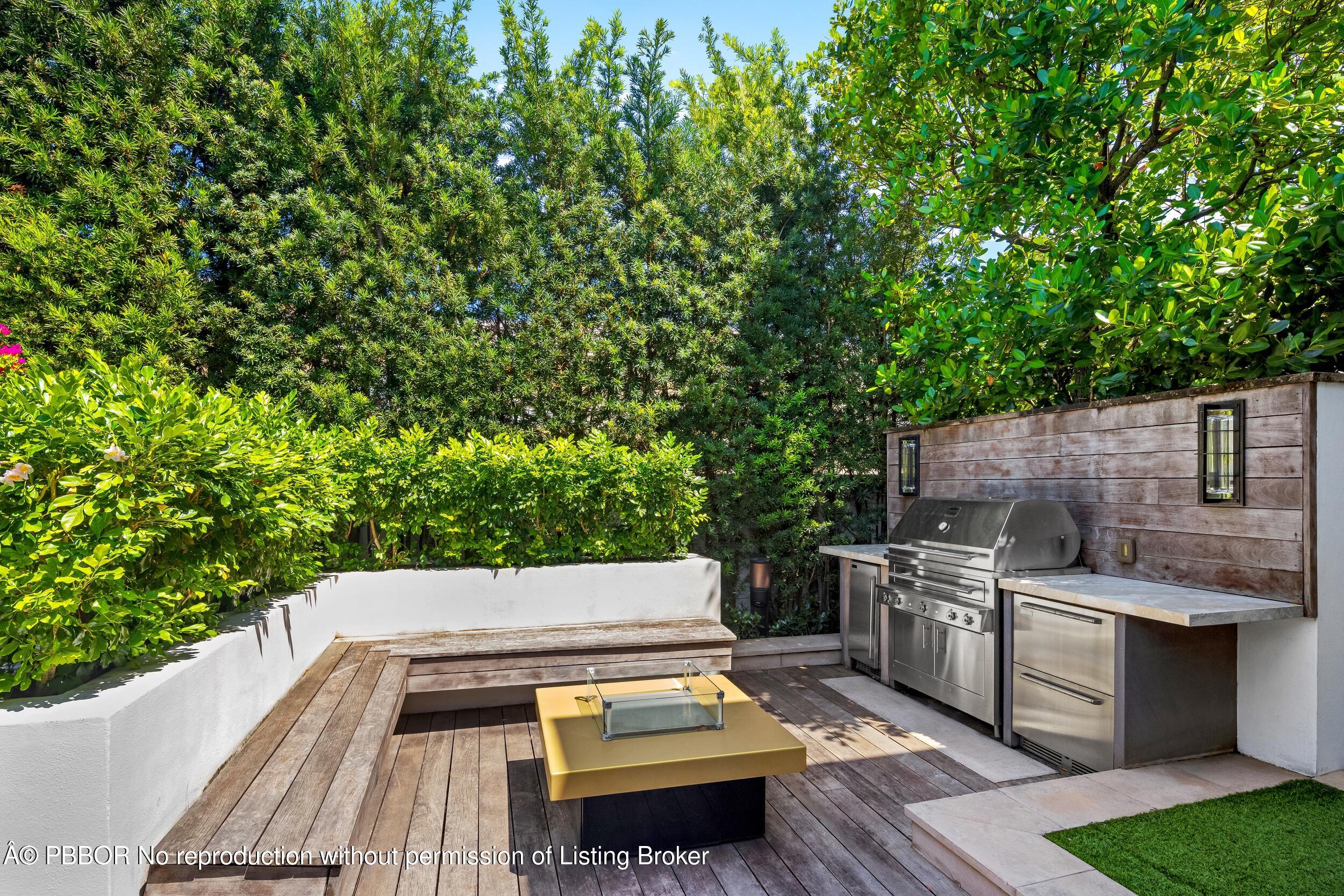 1053 North Lake Way Palm Beach, FL 33480 - Photo 51 of 82 a view of a backyard with chairs