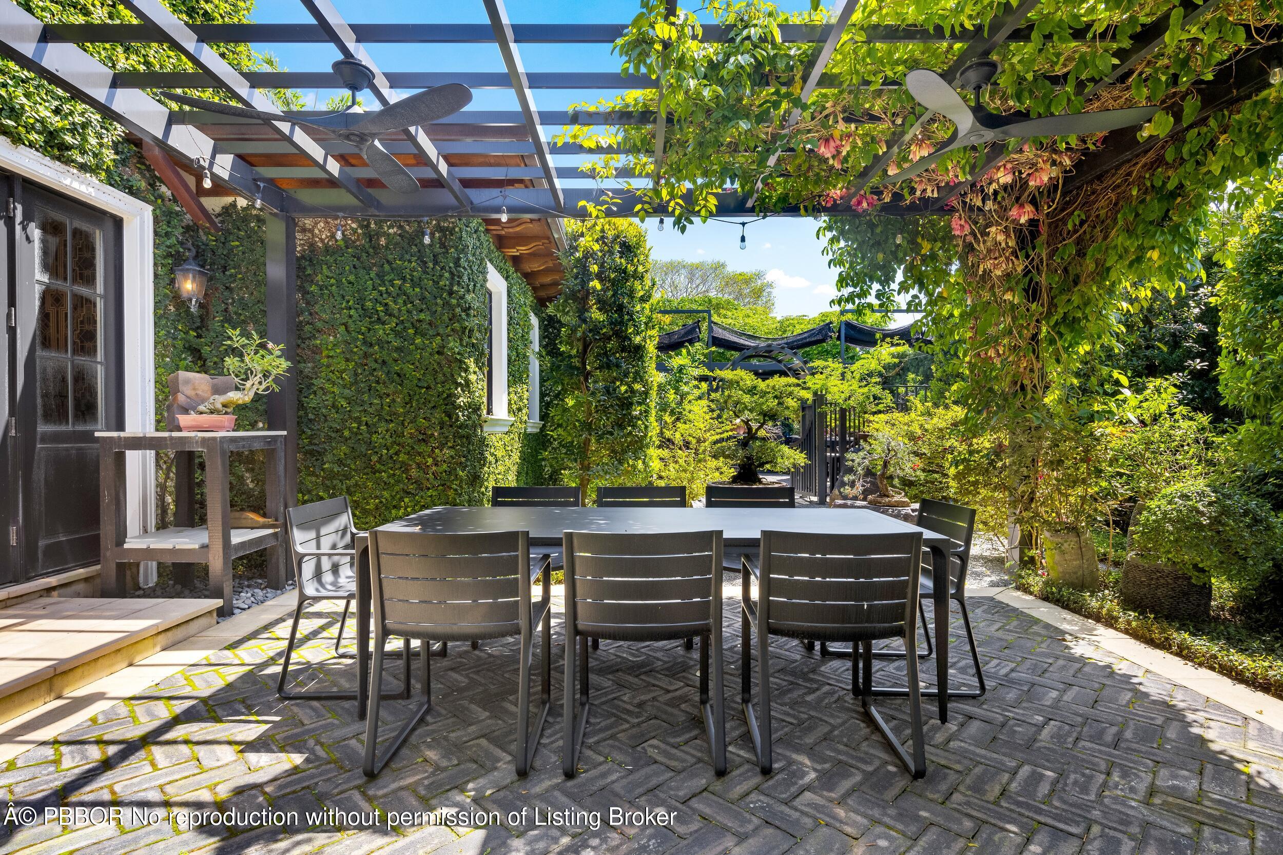 1053 North Lake Way Palm Beach, FL 33480 - Photo 55 of 82 a view of a chairs and table in a patio