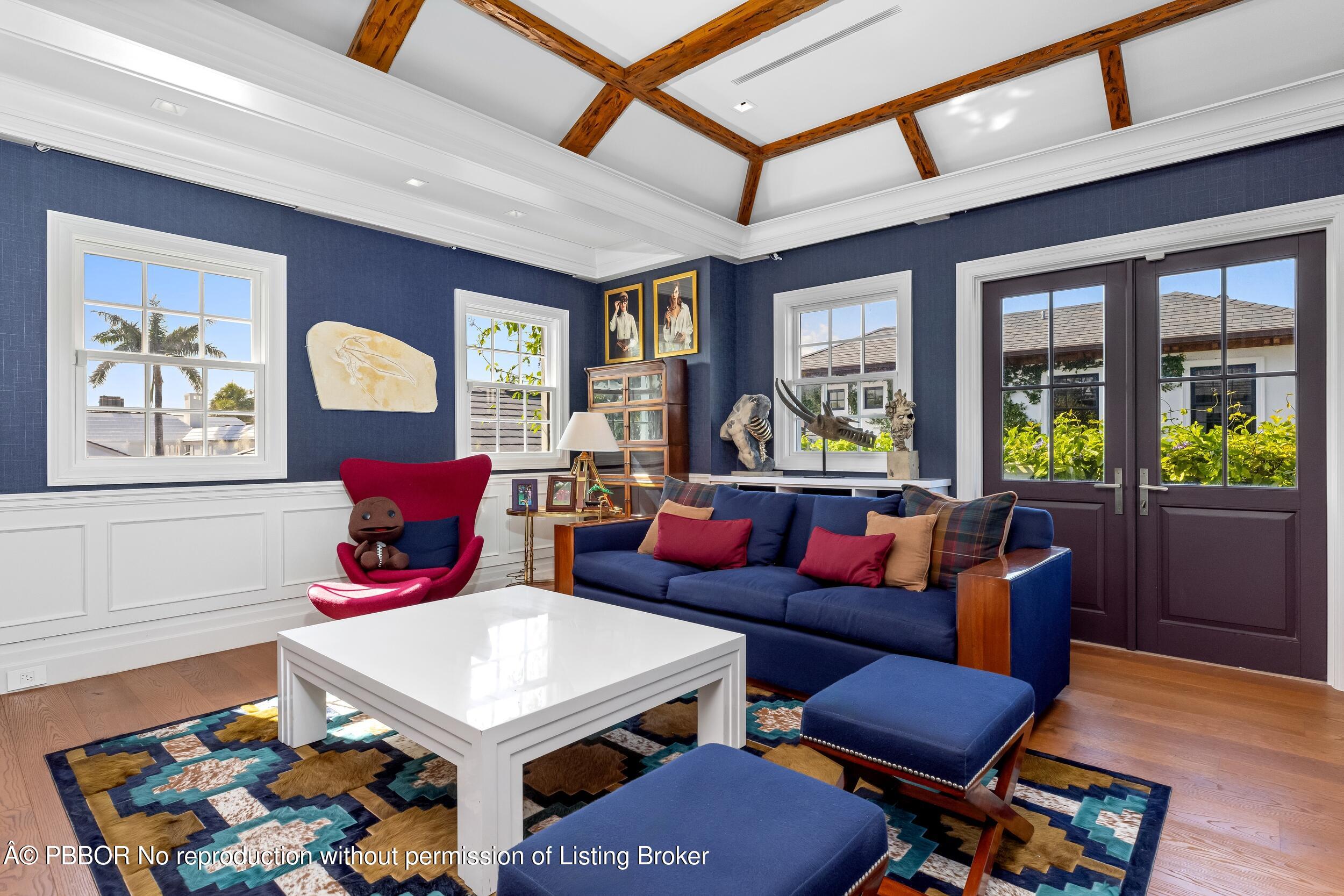 1053 North Lake Way Palm Beach, FL 33480 - Photo 62 of 82 a living room with furniture a rug and a window