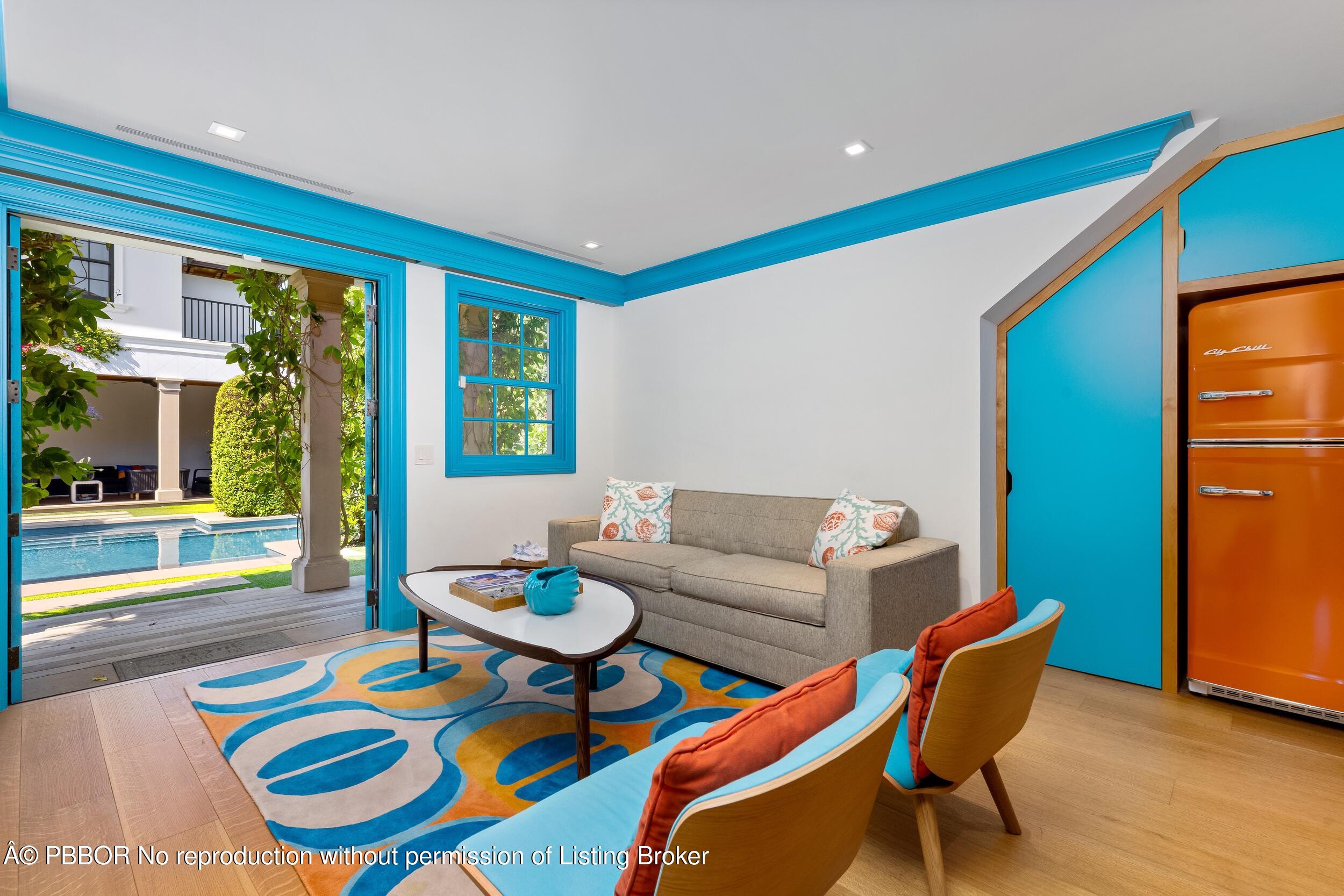 1053 North Lake Way Palm Beach, FL 33480 - Photo 64 of 82 a living room with patio furniture and a large window