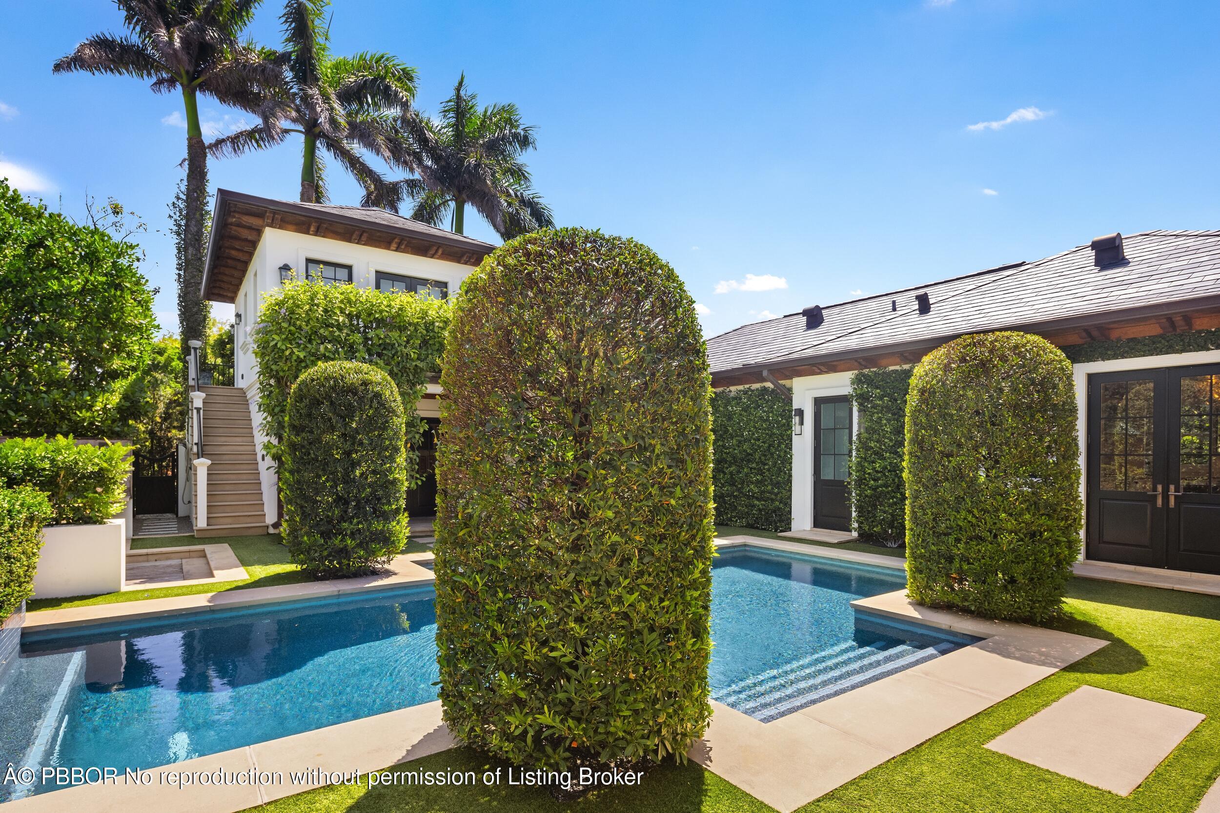 1053 North Lake Way Palm Beach, FL 33480 - Photo 10 of 82 a view of front door and potted plants