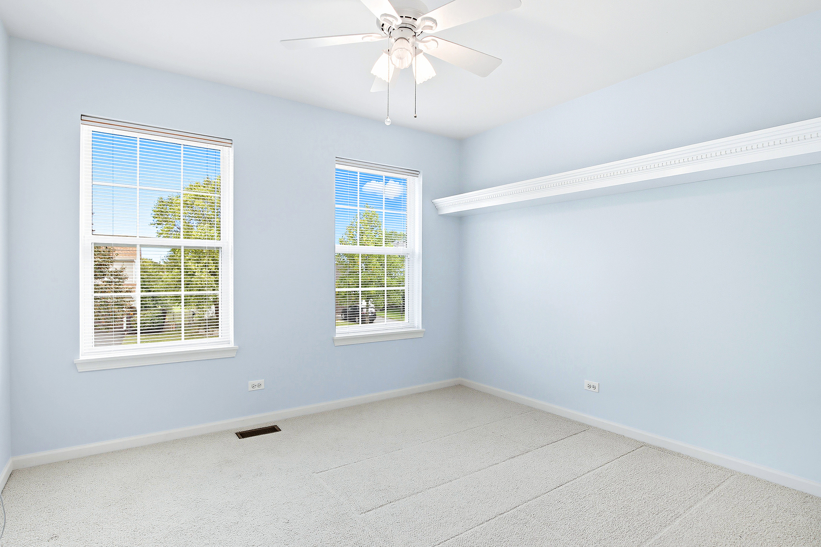 296 Foxford Drive Cary, IL 60013 - Photo 19 of 44 an empty room with a window and a fan