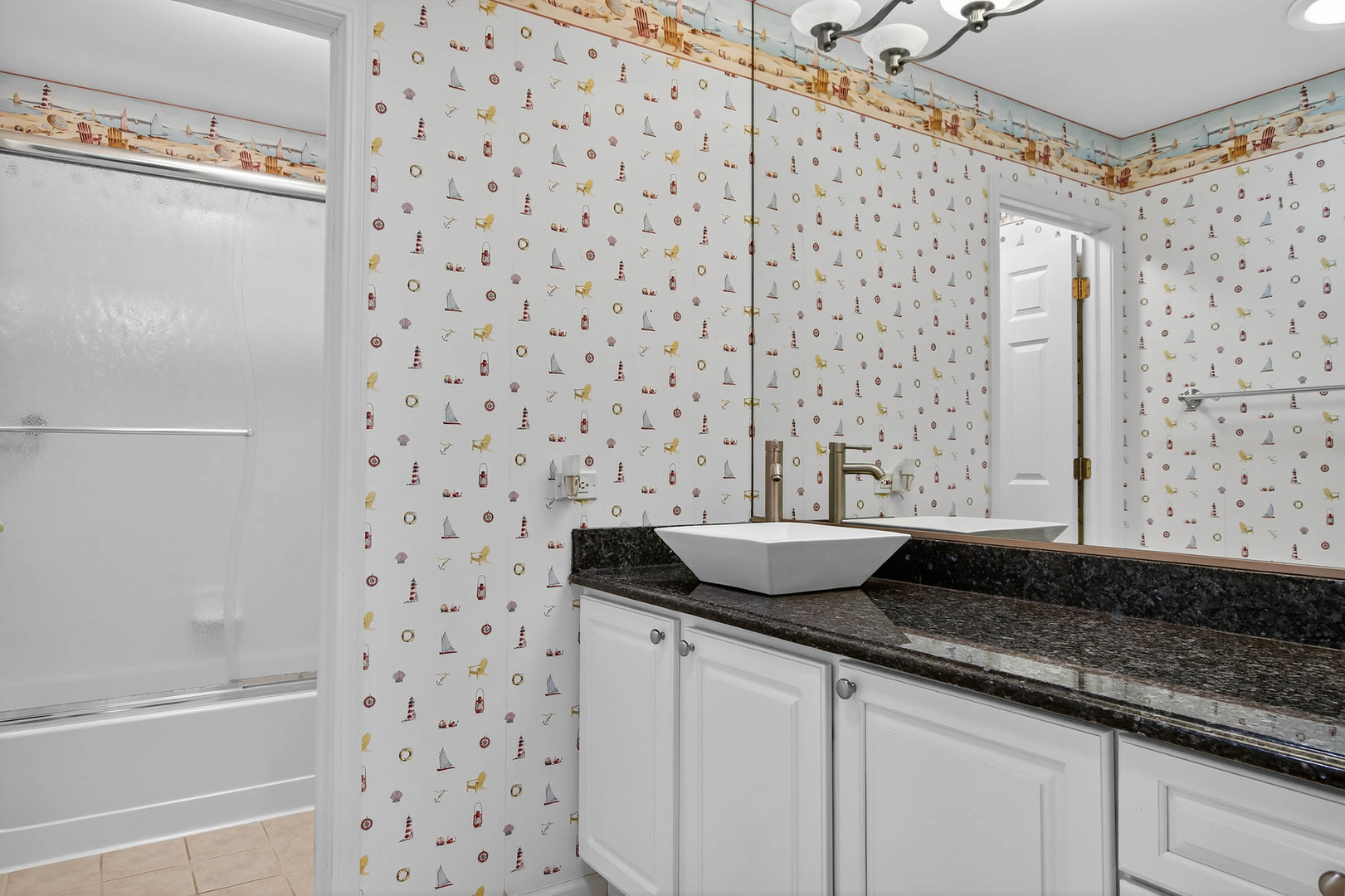 296 Foxford Drive Cary, IL 60013 - Photo 21 of 44 a bathroom with a granite countertop sink a mirror and a bathtub