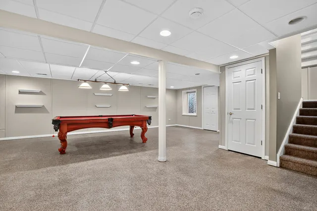 a room with lots of furniture and white walls