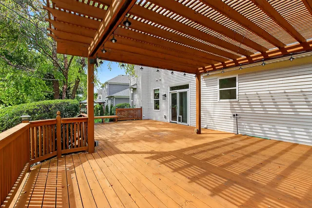 a view of a patio with wooden floor