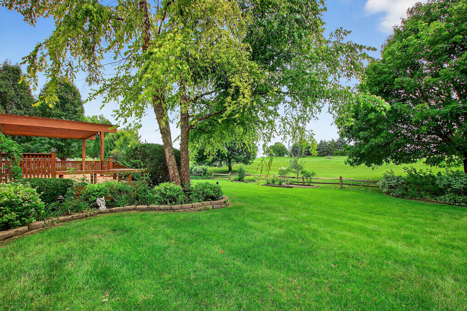 296 Foxford Drive Cary, IL 60013 - Photo 32 of 44 a view of a garden with a tree