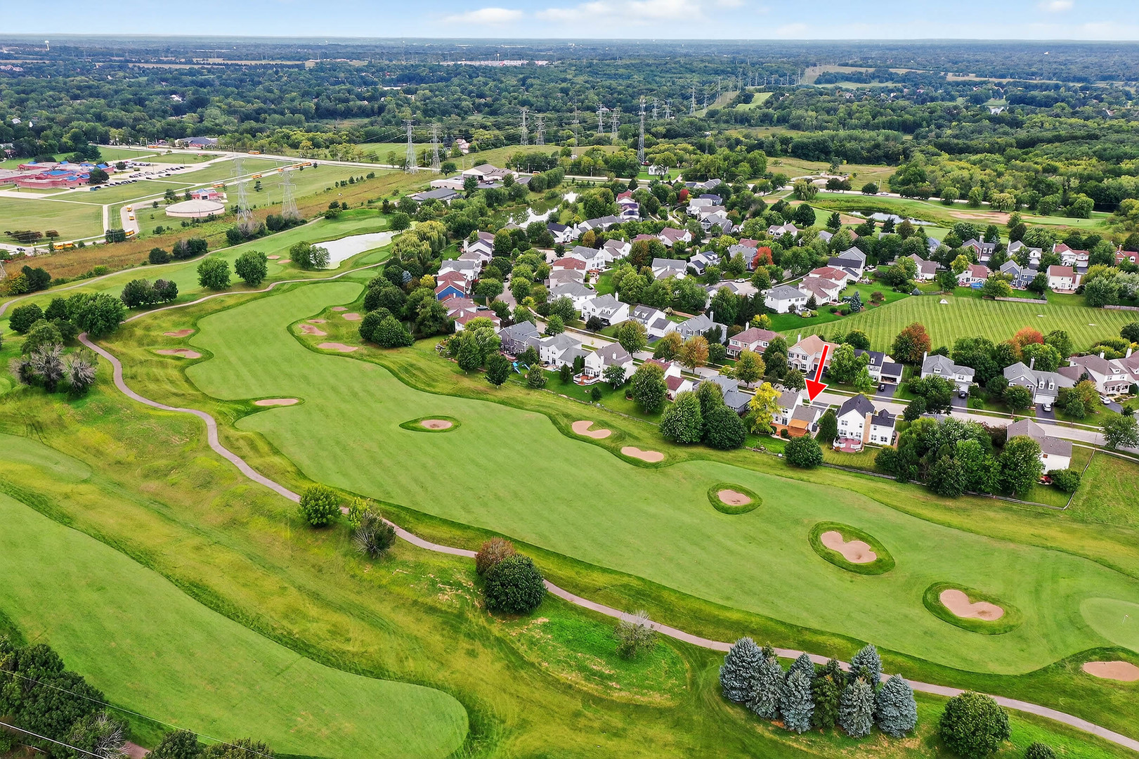296 Foxford Drive Cary, IL 60013 - Photo 39 of 44 an aerial view of a golf course with a huge green field
