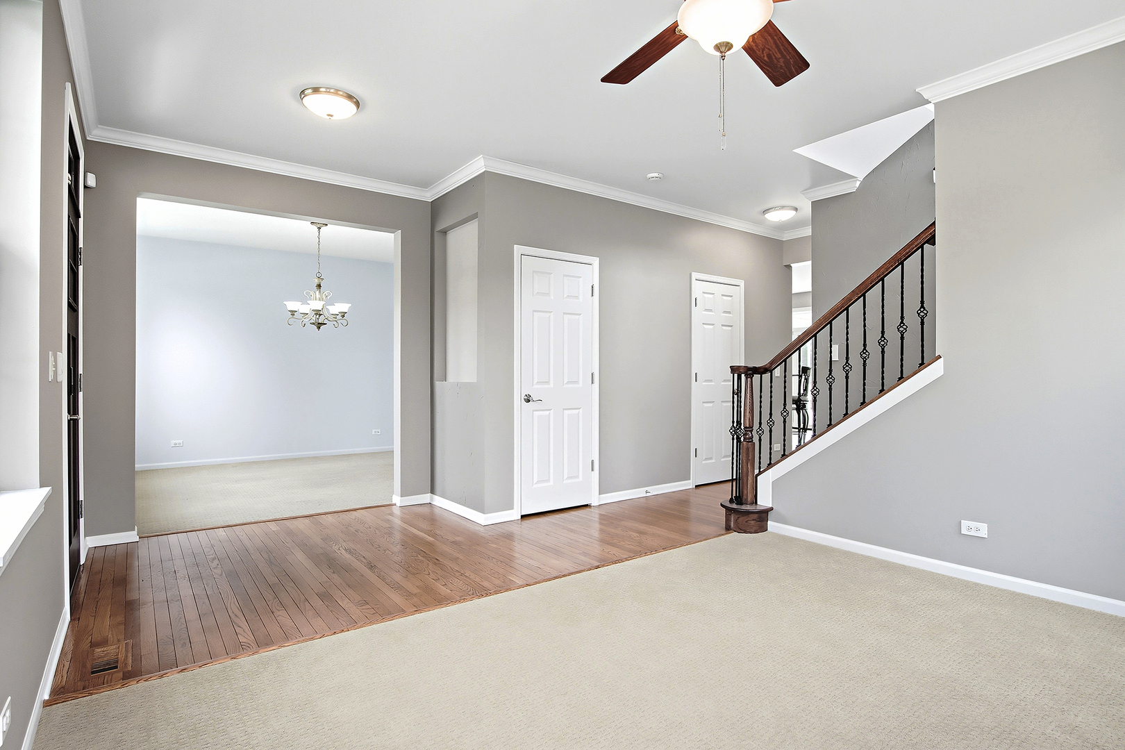 296 Foxford Drive Cary, IL 60013 - Photo 4 of 44 a view of an empty room and gallery with wooden floor