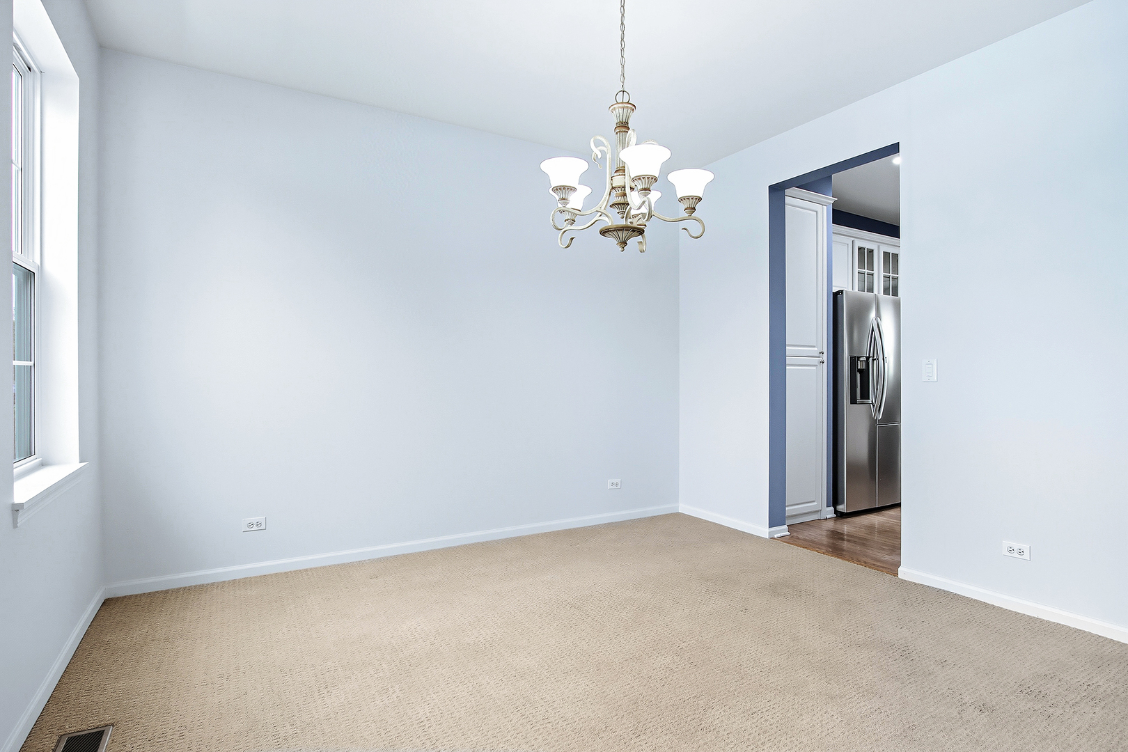 296 Foxford Drive Cary, IL 60013 - Photo 5 of 44 an empty room with chandelier fan