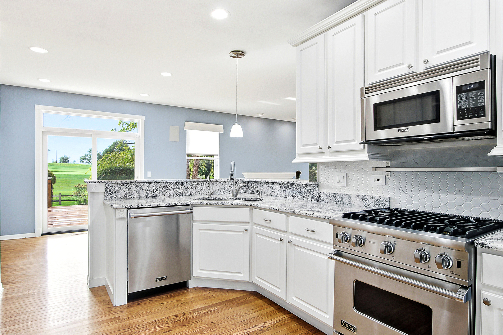 296 Foxford Drive Cary, IL 60013 - Photo 7 of 44 a kitchen with stainless steel appliances granite countertop a stove and a microwave