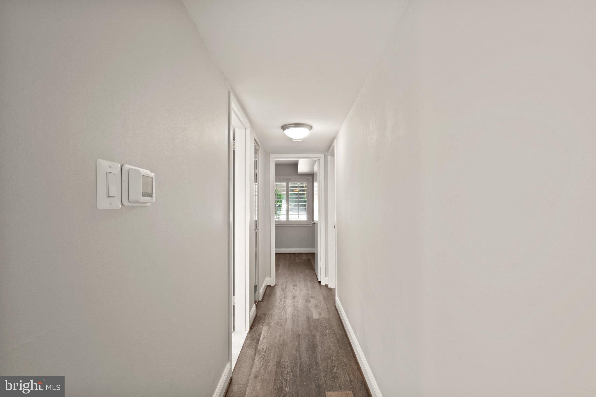 1414 Northgate Square, Unit 14/1B Reston, VA 20190 - Photo 21 of 49 Hallway to bedroom area