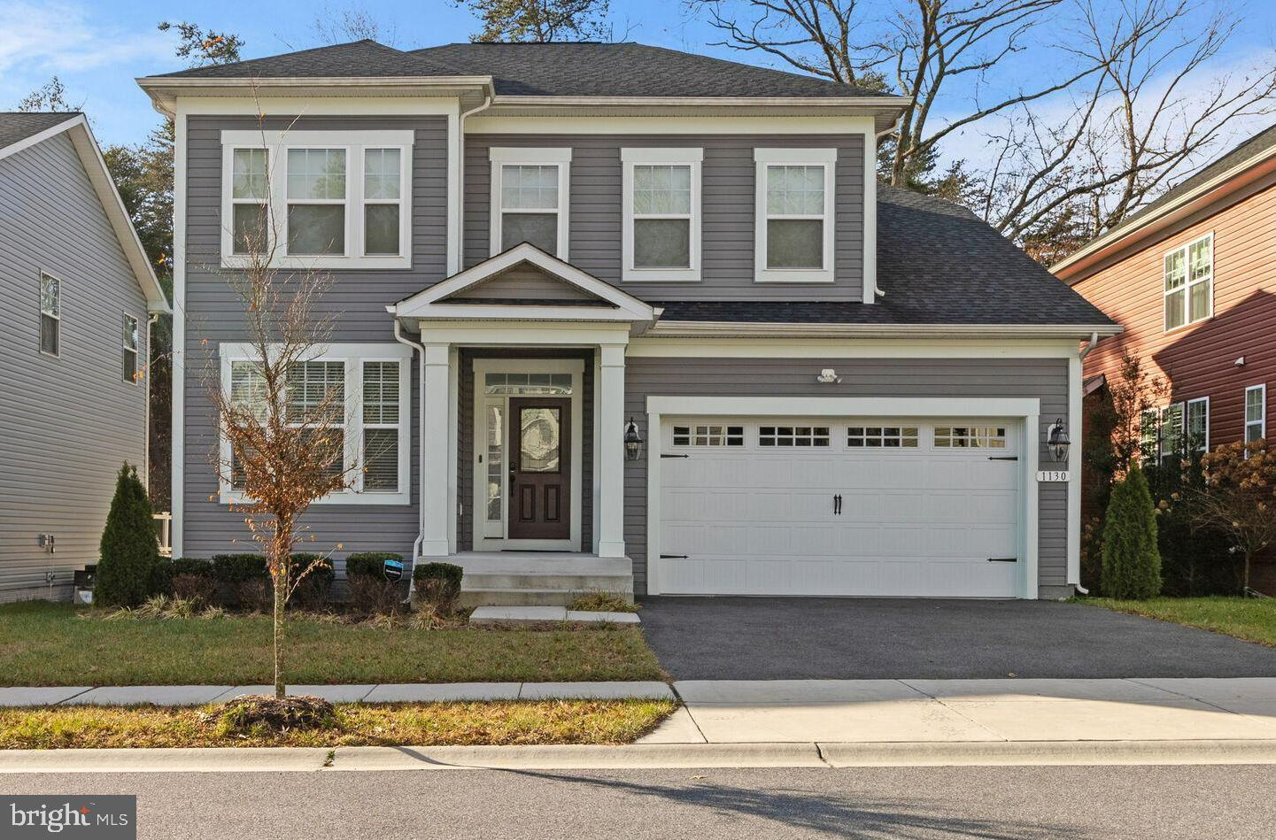 1130 Chevron Road Severn, MD 21144 - Photo 1 of 1 a front view of a house with a yard