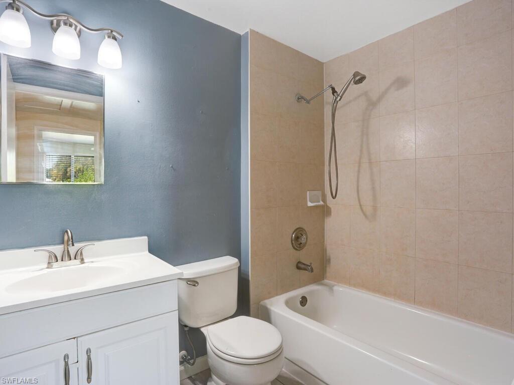 9101 Hamlin Road West Fort Myers, FL 33967 - Photo 22 of 24 a bathroom with a sink toilet and shower