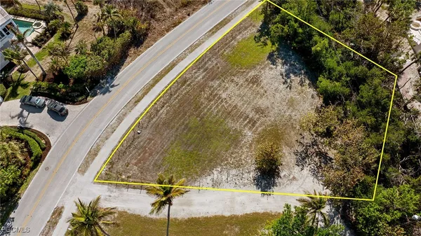 a view of a swimming pool and an outdoor seating