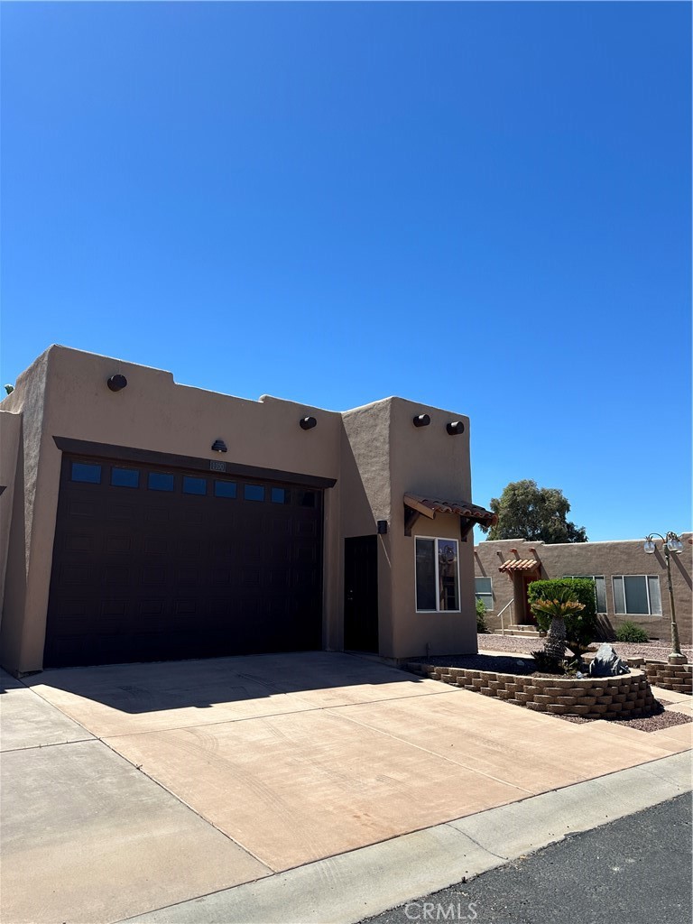 1100 Beach Drive Needles, CA 92363 - Photo 2 of 13 a front view of a house with a yard