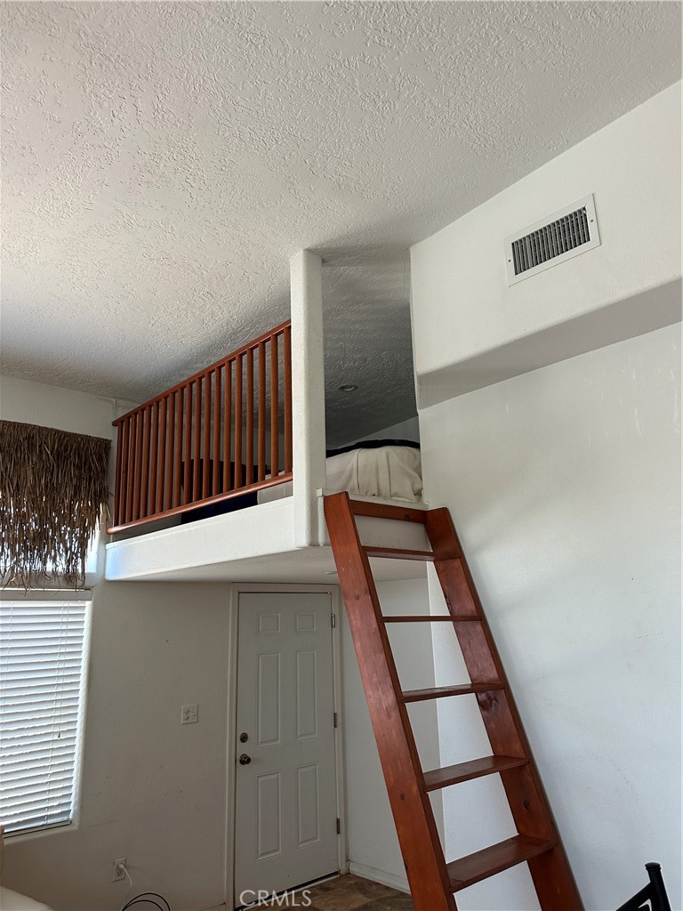 1100 Beach Drive Needles, CA 92363 - Photo 8 of 13 a view of staircase with white walls