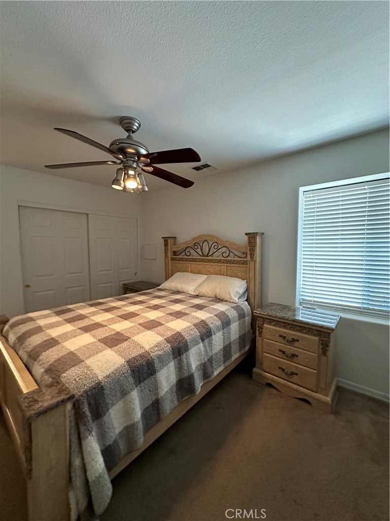 1100 Beach Drive Needles, CA 92363 - Photo 9 of 13 a bedroom with a bed and window