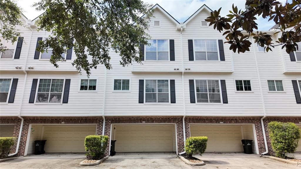 a front view of a house with a garage