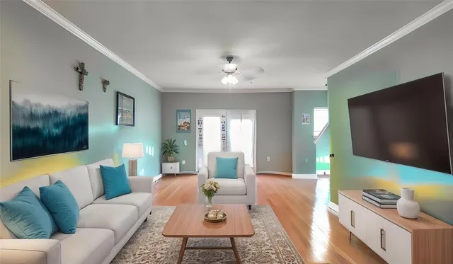 a living room with furniture and a flat screen tv