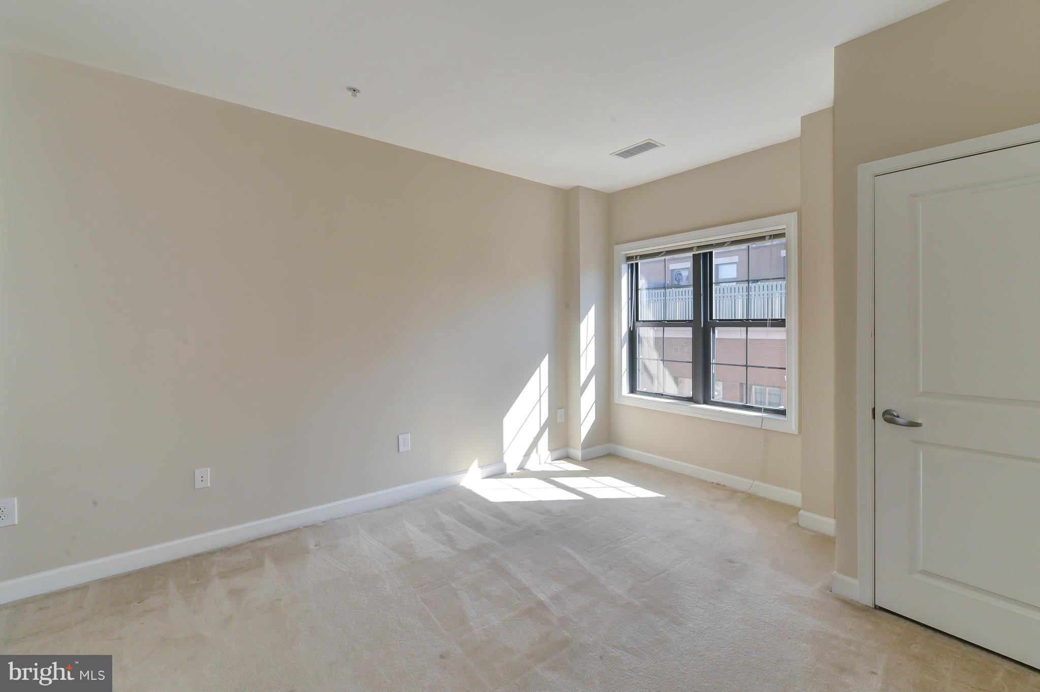 1111 25th Street Northwest, Unit 905 Washington, DC 20037 - Photo 11 of 25 a view of an empty room with a window