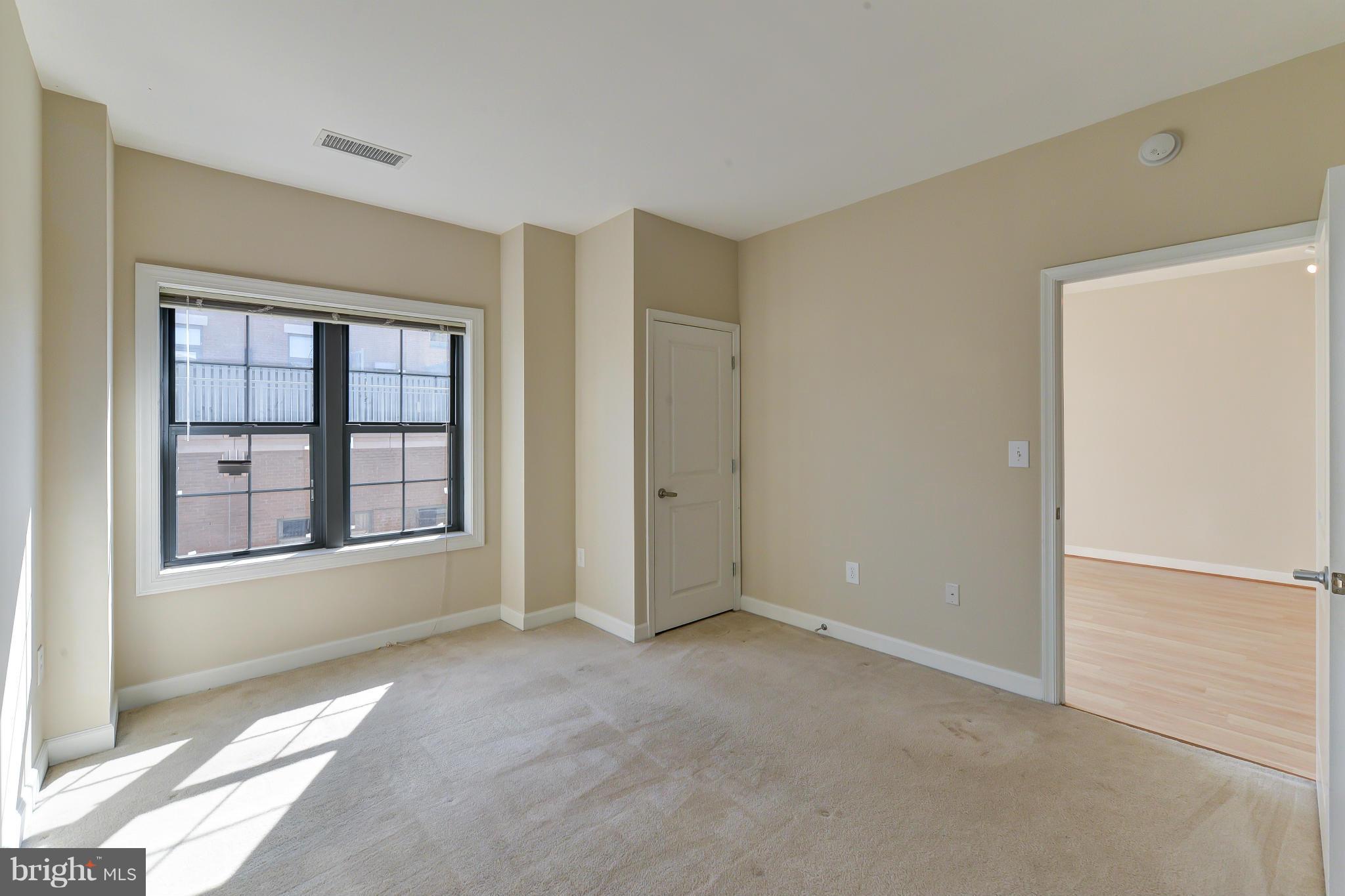 1111 25th Street Northwest, Unit 905 Washington, DC 20037 - Photo 10 of 25 a view of an empty room with a window