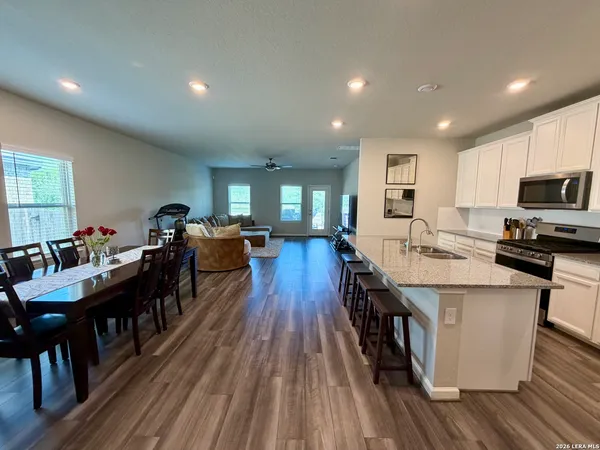 a large kitchen with lots of counter space and stainless steel appliances