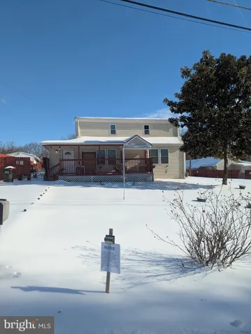 a view of house with outdoor space