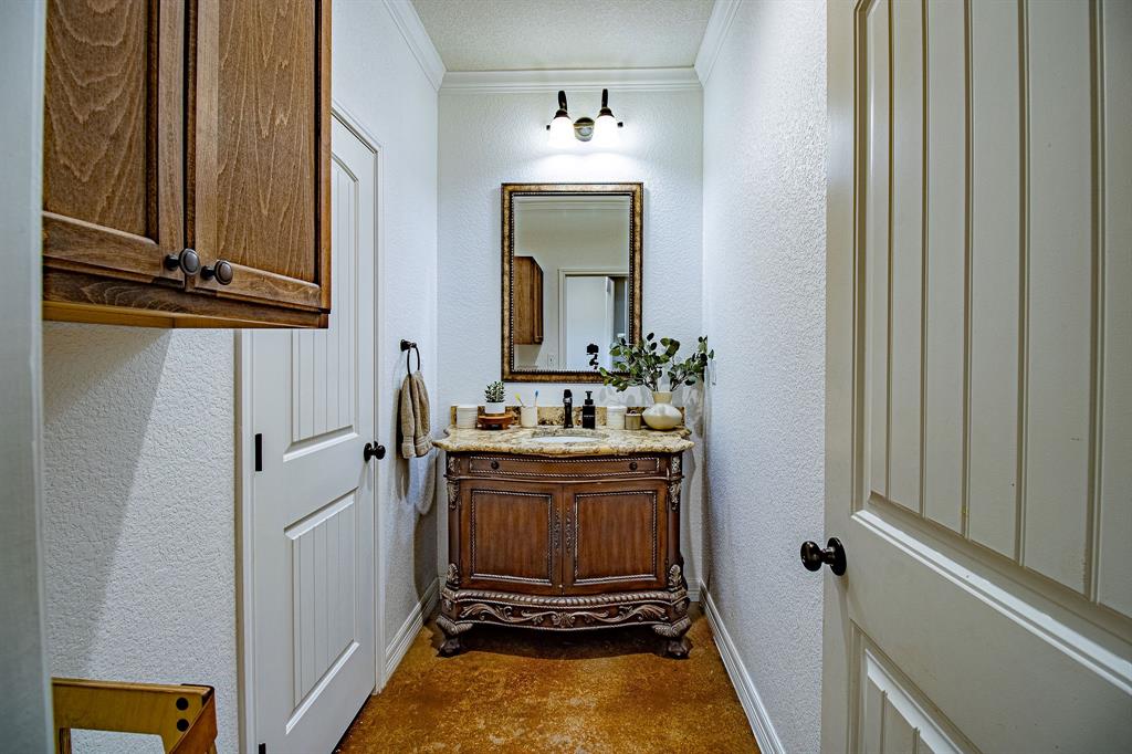 328 Meadow Lane Red Oak, TX 75154 - Photo 11 of 35 Bathroom featuring ornamental molding, vanity, and a textured wall
