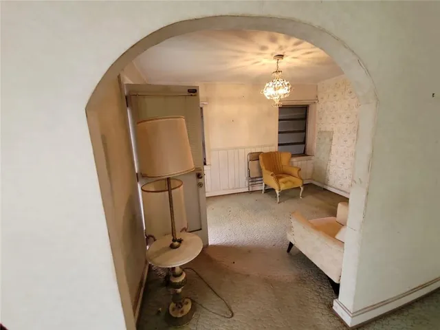 a view of a livingroom with furniture and a window