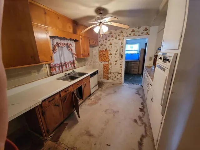 a bathroom with double vanity and a sink