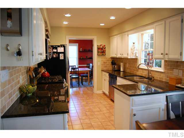 2 Swallows Ridge Court Durham, NC 27713 - Photo 2 of 25 Kitchen updates include stainless steel appliances, granite, tile, tranvertine backsplash, decorator colors and more... Cafeteria/Kitchen