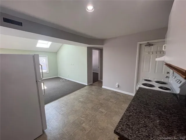 a view of a bathroom from a hallway