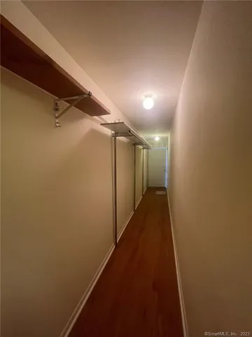 a view of a balcony with two chairs and a table