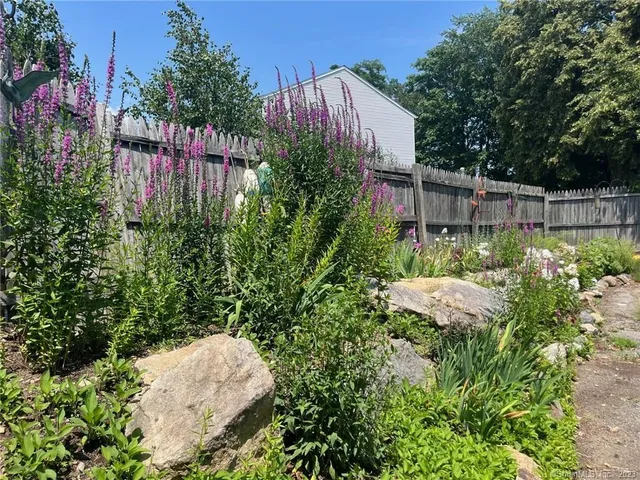 a view of a street with a car park in front of it