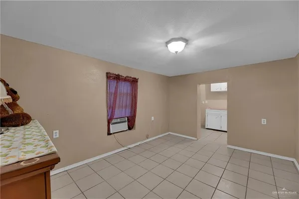 a view of an empty room and window