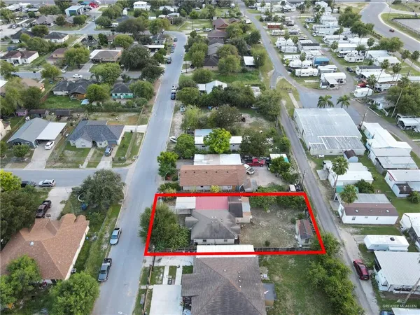 an aerial view of residential houses with outdoor space