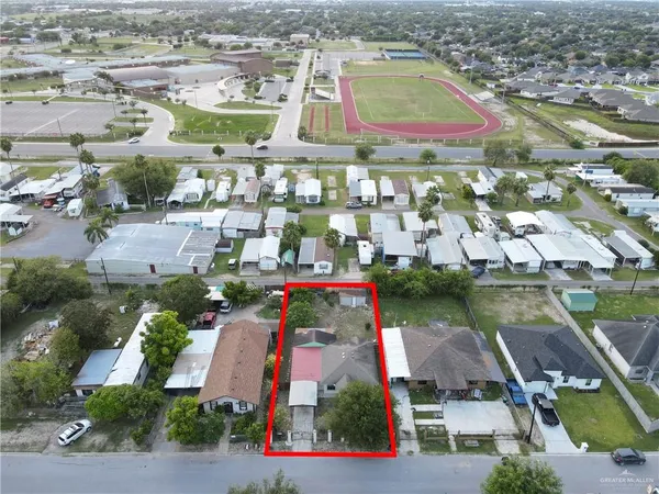 an aerial view of residential houses with outdoor space