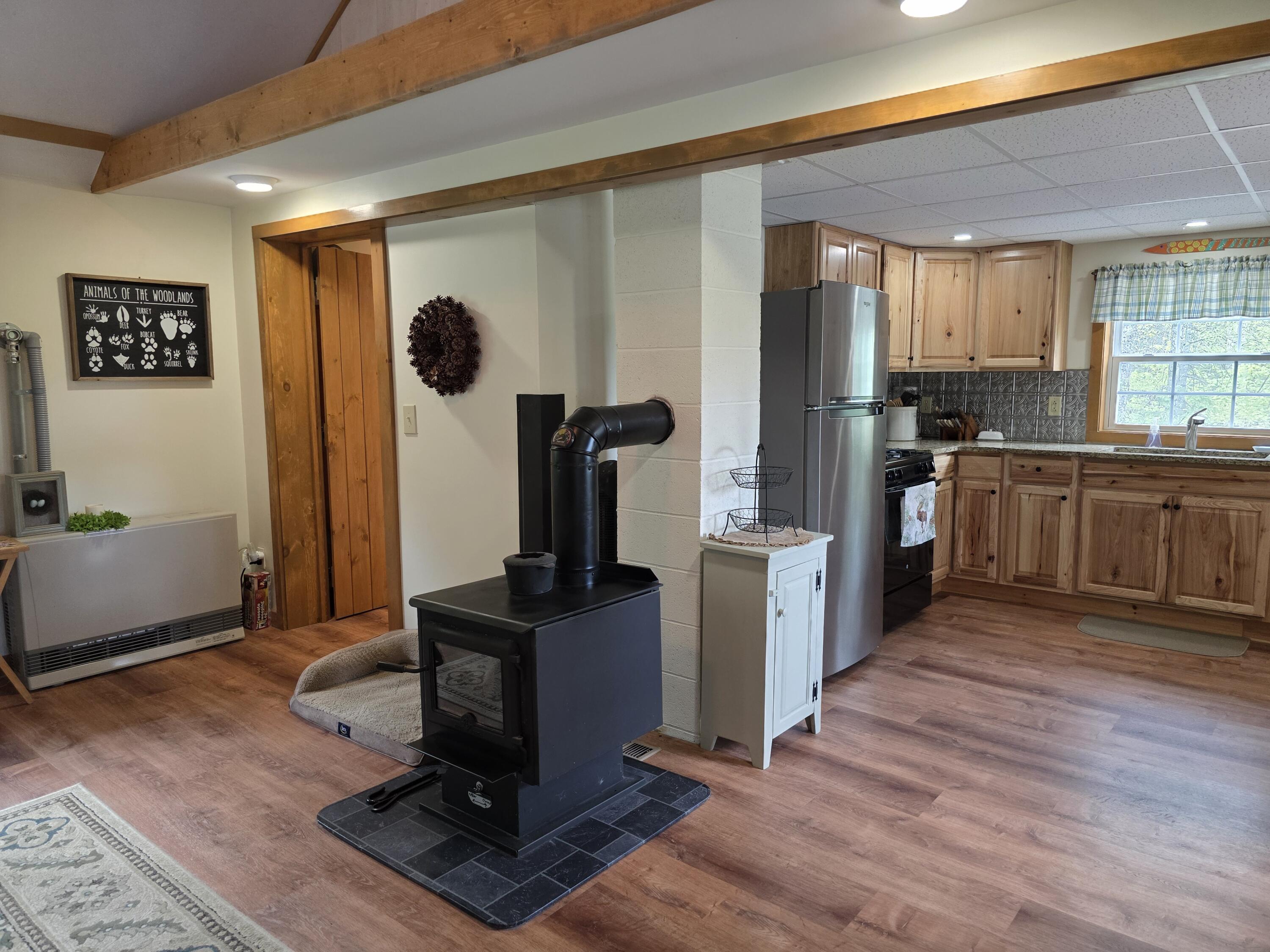 25 Oak Ridge Road Shirley Mills, ME 04485 - Photo 22 of 43 View Kitchen, Wood Stove