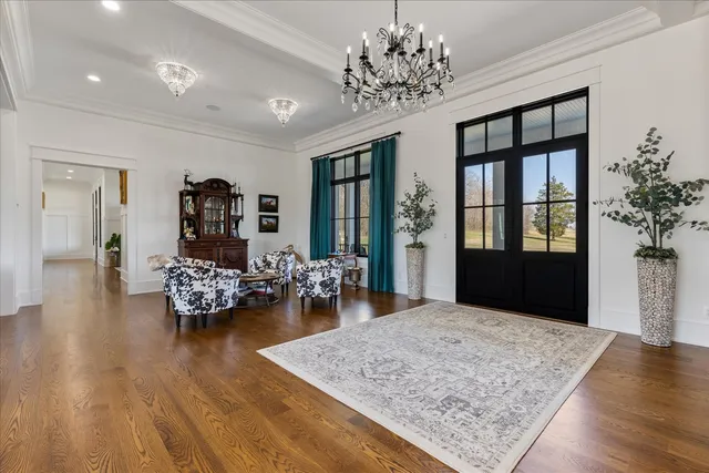 a living room with fireplace furniture and a wooden floor