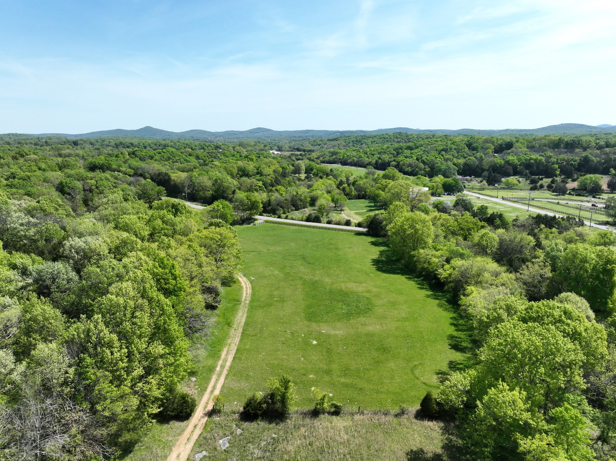 6180 Southeast Tater Peeler Road Lebanon, TN 37090 - Photo 86 of 89 an aerial view of green landscape with trees houses and mountain view