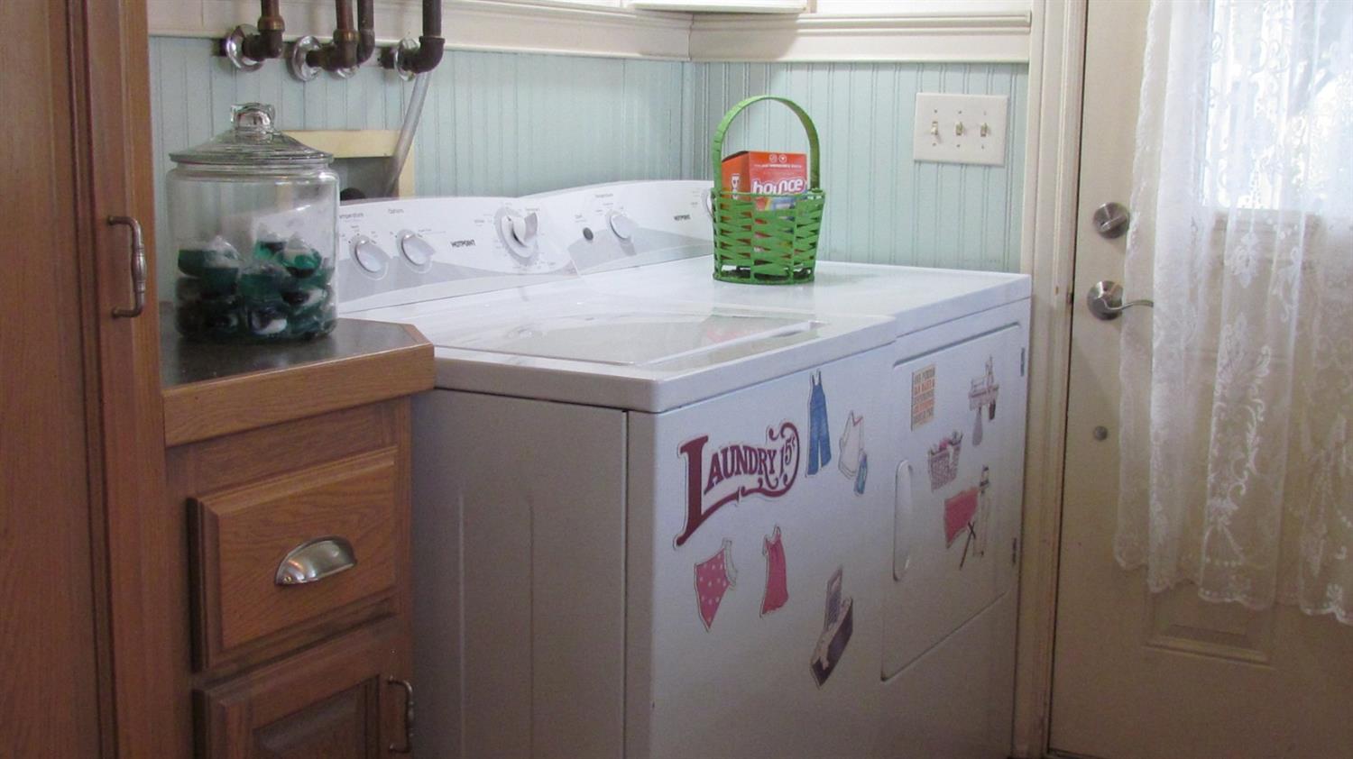 523 North Buttonwillow Avenue Reedley, CA 93654 - Photo 50 of 85 Lots of cabinets in the main house laundry room - even a tankless hot water heater.....