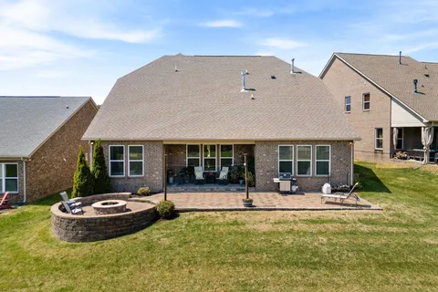 an aerial view of a house with garden space and street view