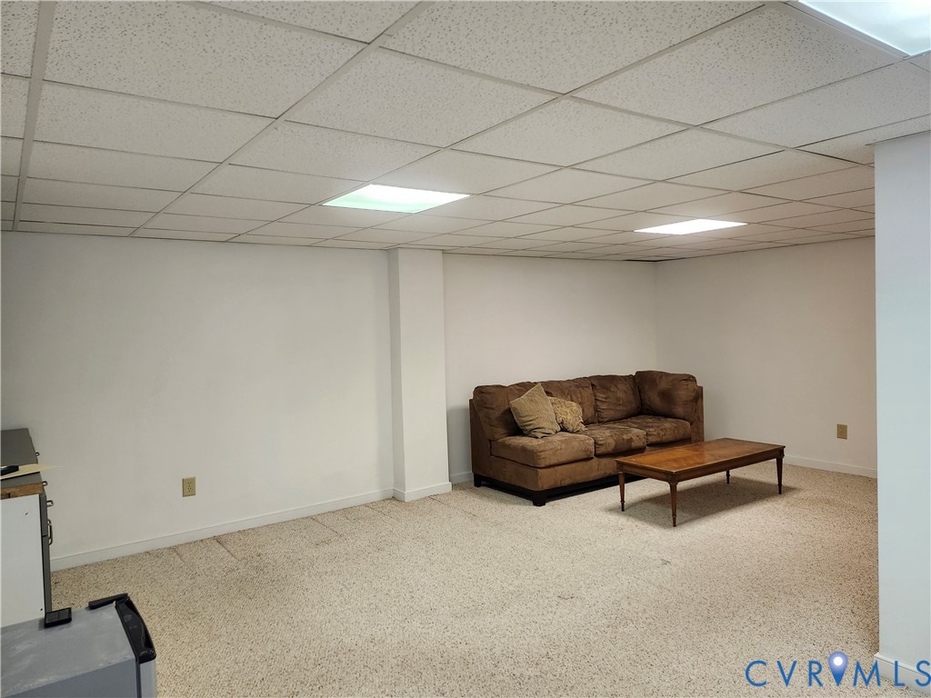 4419 Boones Bluff Way Chesterfield, VA 23832 - Photo 21 of 35 a living room with furniture and a walk in closet