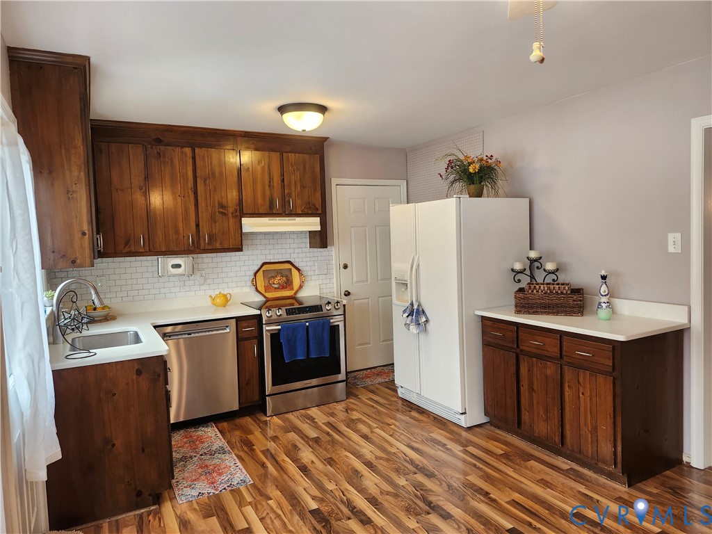 4419 Boones Bluff Way Chesterfield, VA 23832 - Photo 7 of 35 a kitchen with a sink appliances and cabinets