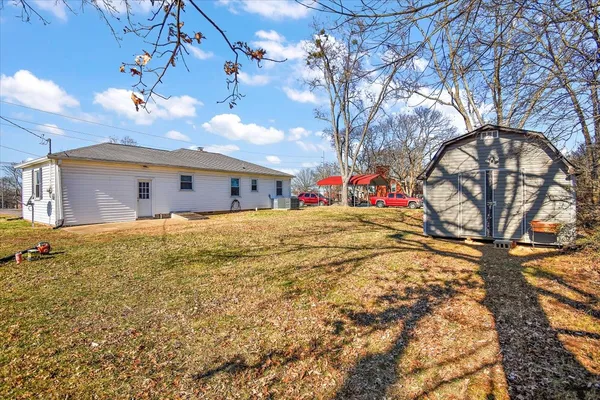 a view of large house with a snow and a yard