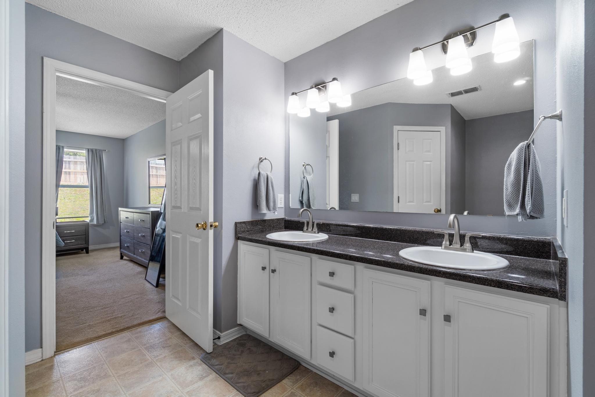 237 Trish Drive Crestview, FL 32536 - Photo 19 of 41 a bathroom with double sink and a mirror